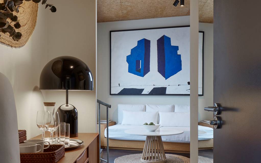 A modern and stylish bedroom featuring a comfortable bed, chic decor, and ambient lighting for a cosy atmosphere.