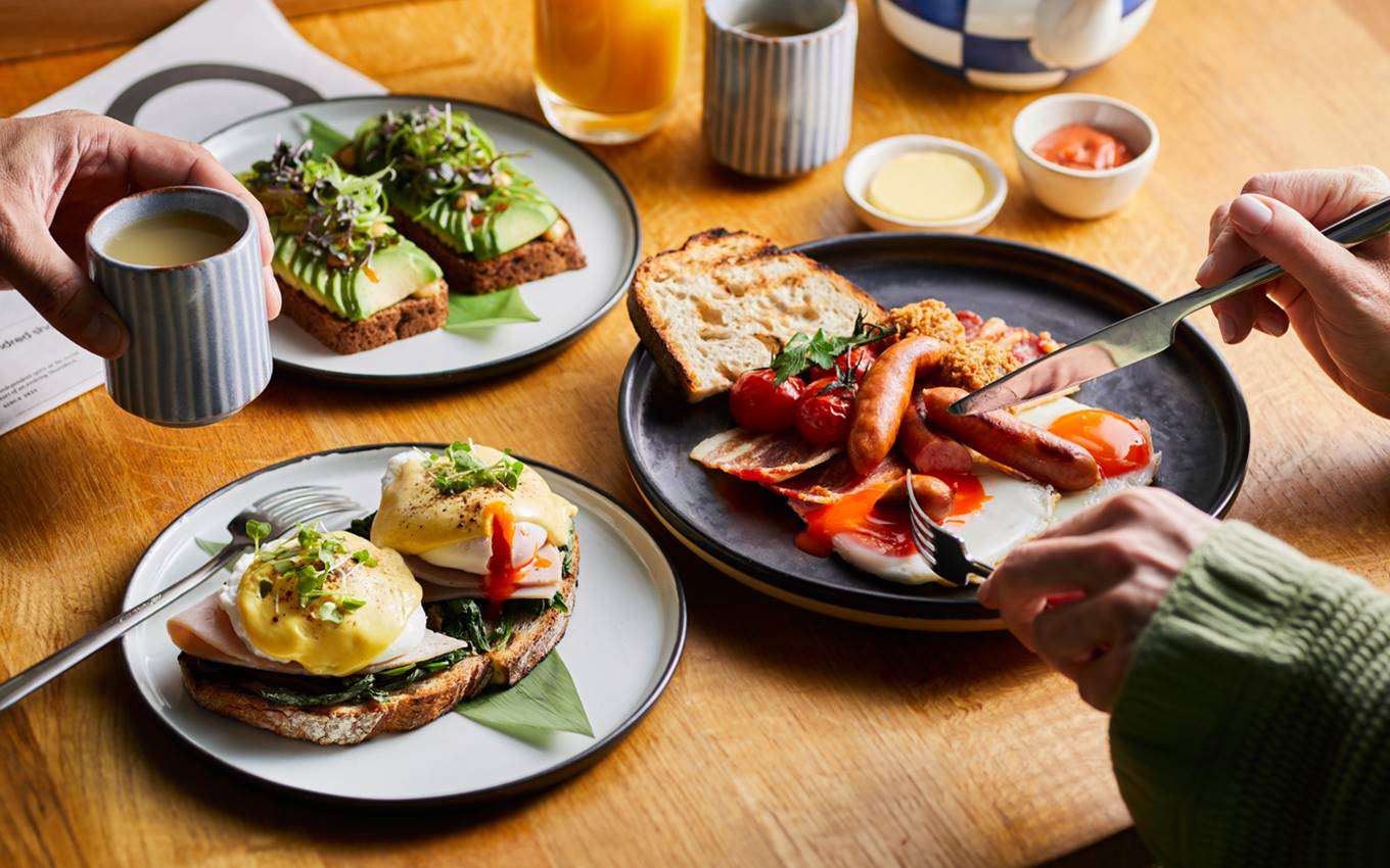 A table set with an array of food and drinks, inviting and ready for a gathering or celebration.