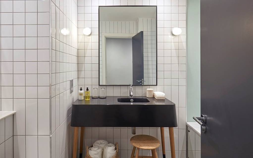 A stylish bathroom featuring a classic black and white tile floor, creating a timeless and elegant atmosphere.